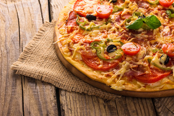 pizza served on wooden table