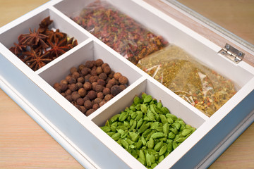 set of spices in a wooden box