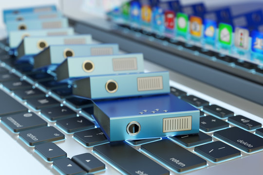 Office Paperwork, Computer Data Storage, Archive Documentation Catalog And Electronic Document Management Concept, Pile Of Blue Ring Binders On Laptop Keyboard