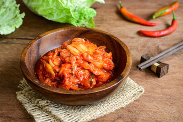 kimchi with Chopsticks on wooden table, korean traditional food - obrazy, fototapety, plakaty