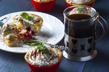 Cupcake with cherry and pineapple on white plate