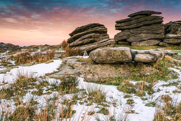 Granite tor on frosty morning in Dartmoor, England.