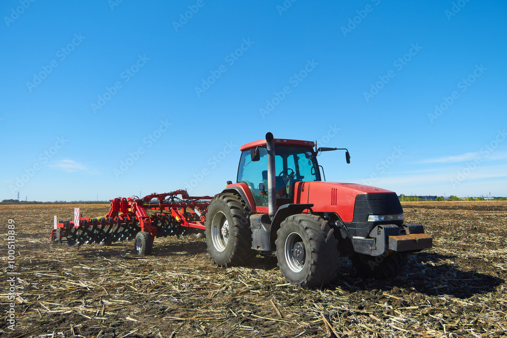 Poster red tractor in a field