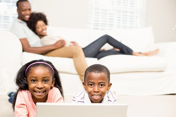 Fototapeta premium Happy kids using laptop pc