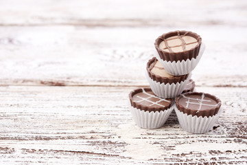 Dark chocolate on wooden background