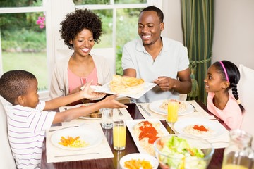 Happy family eating together
