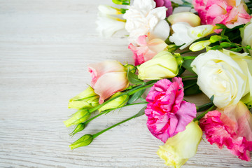 bouquet of beautiful flowers on wooden surface