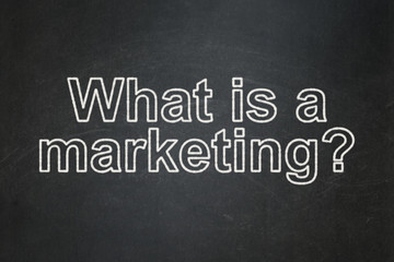 Obraz premium Advertising concept: What is a Marketing? on chalkboard background