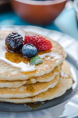 Close view on pancakes stack with fruit