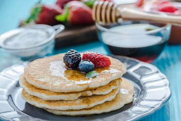 Close view on pancakes stack with fruit