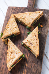 Healthy sandwich sliced on board