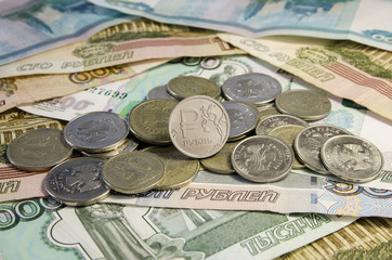 Russian roubles coins on banknotes