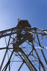 high metal tower on blue sky background