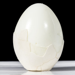 Half-peeled boiled egg