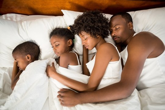 Peaceful family sleeping