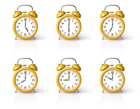 Orange ringing alarm clock isolated on white background