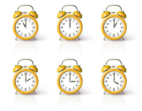 Orange ringing alarm clock isolated on white background