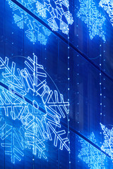 Christmas lights decoration on a building facade in blue tone