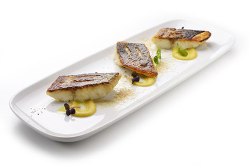 Sea bass fillet on persimmon sauce and powdered foie gras