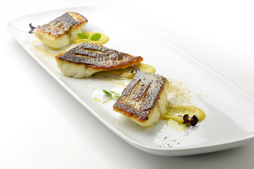 Sea bass fillet on persimmon sauce and powdered foie gras