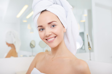 Attractive Young Woman Wrapped with Bath Towels