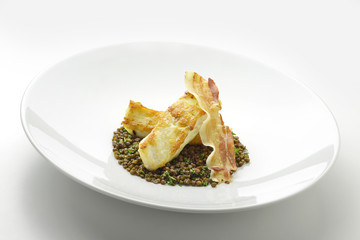 Turbot fillet with lentils and crispy bacon