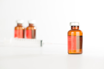 Brown medicine ampule on white