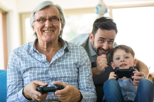 Family playing video game at home