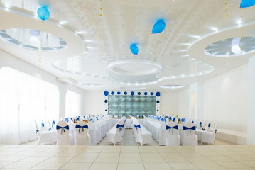 blue and white interior of the restaurant.
Restaurant interior with blue and white colour scheme
