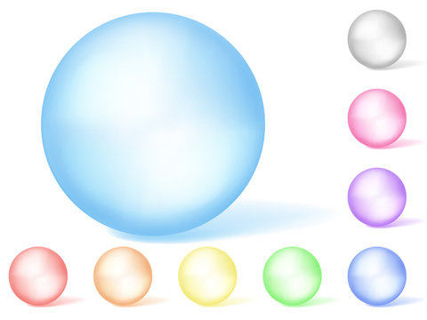 Set of multicolored translucent spheres on white background