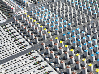 Obraz premium Giant audio sound mixer with color buttons and sliders