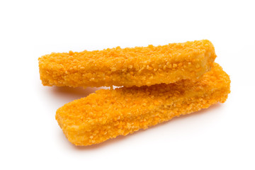 Frozen bread crumbed fish fingers on white.