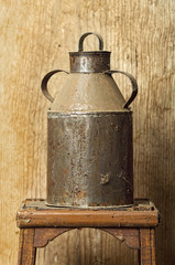 old tin for foods liquids with wooden background