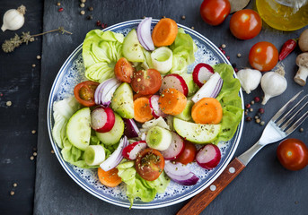 Healthy vegetables salad mix with radish,tomatoes,cucumber,carro