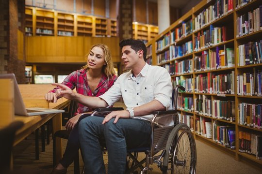 Student in wheelchair working with a classmate