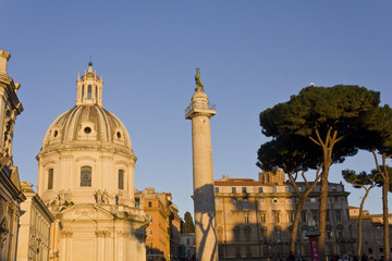 Fototapeta na wymiar Day view of the Trajan column and the Santa Maria di Loreto Church in Rome, Italy