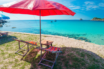 Beach chair with umbrella in seashore