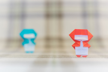 The Handmade Origami Ninja Kids on the Fabric Background
