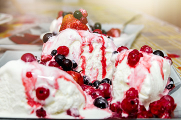 delicious vanilla ice cream with fruit in plate
