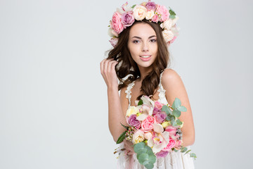 Smiling young woman posing with flowers