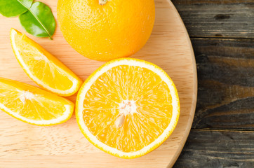 Fototapeta na wymiar Fresh navel orange fruit on wooden background,healthy food