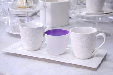 Three white cups on a tray