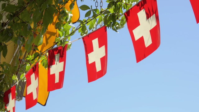 Swiss flag flapping in the summer sun. 