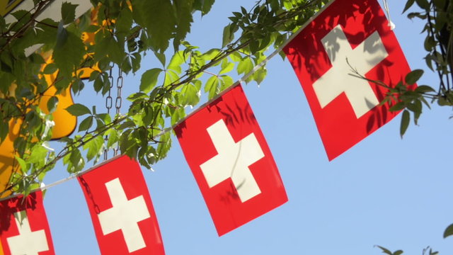 Swiss flag flapping in the summer sun. 
