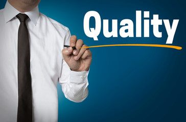 Quality is written by businessman background concept