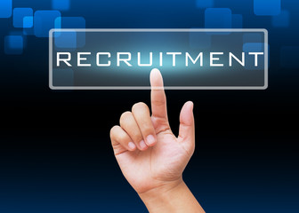 Hand pressing Recruitment button with technology background 