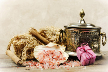 spa concept with himalayan pink salt and scrub sponge