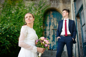 Wedding couple on the background of an old door