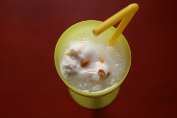 Cocomilk ice cream with coconut water in yellow glass, Thai styl