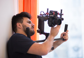 Professional videographer with gimball video slr